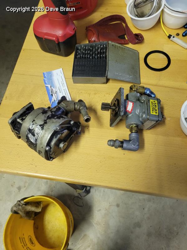 2024-02-11 18.06.49.jpg - It was easier to remove the fuel pump (right) and the vacuum pump (left) at the same time.