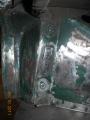 A car number plate forward of the radiator valance