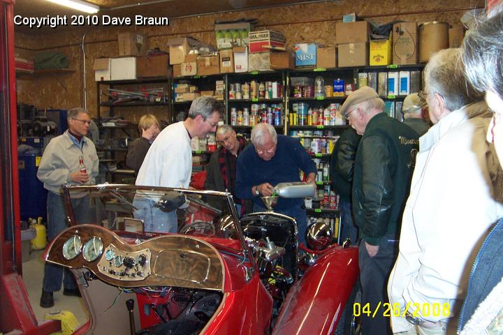 Adding Coolant.jpg - Adding coolant at a tech session. It was supposed to be an engine start demonstration. However a mismatch between head gasket and head resulted in water everywhere!