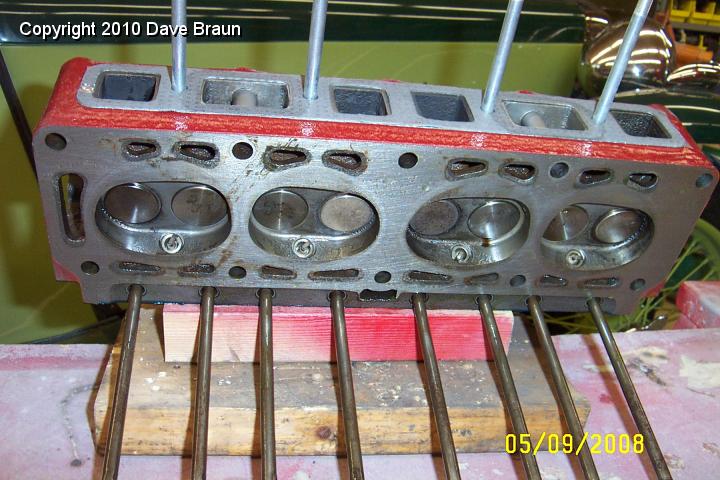 Head on Bench.jpg - Head with pushrods.