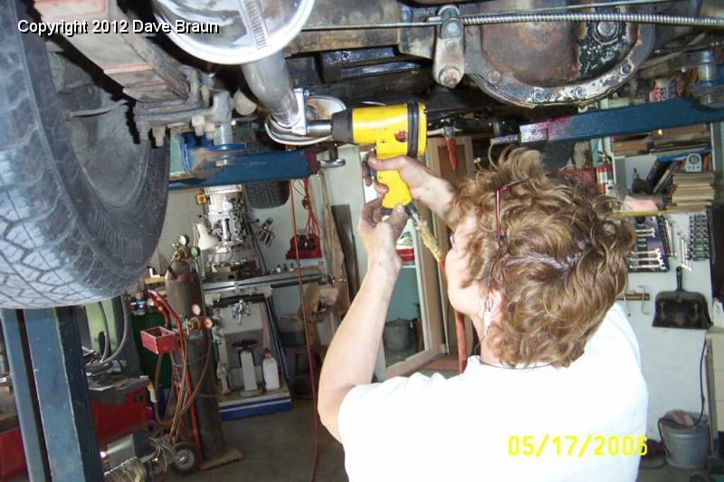 zipping the muffler clamp bolts snug.jpg