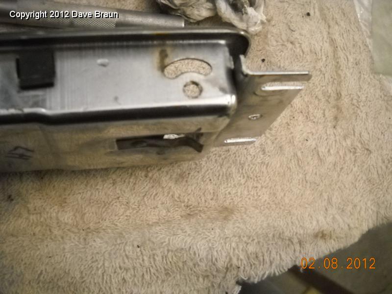 LH lock lever spring pull the pins on the lock lever to remove 01.jpg
