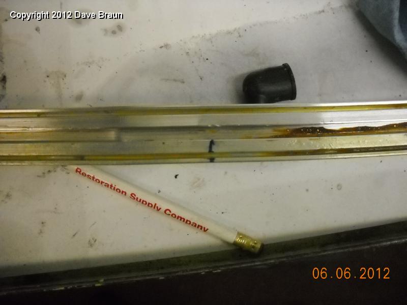 Centerline marked on extrusion and contact cement applied.jpg