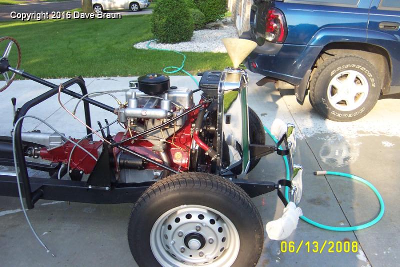 Flushing system 1.jpg - Since debris seemed to come out of the block each time I drained the coolant, I decided to flush the system several times with fresh water.