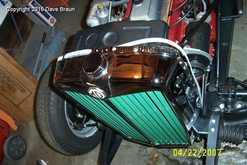 Installing bonnet rub strip on shell.jpg - Installing bonnet rub strip. Starting in the middle, leaving enough slack to install the front bonnet hinge bracket later. It's white because it has a lot of talc on it. I wiped off the talc after I installed it. The next one I install I'll wipe the talc first.