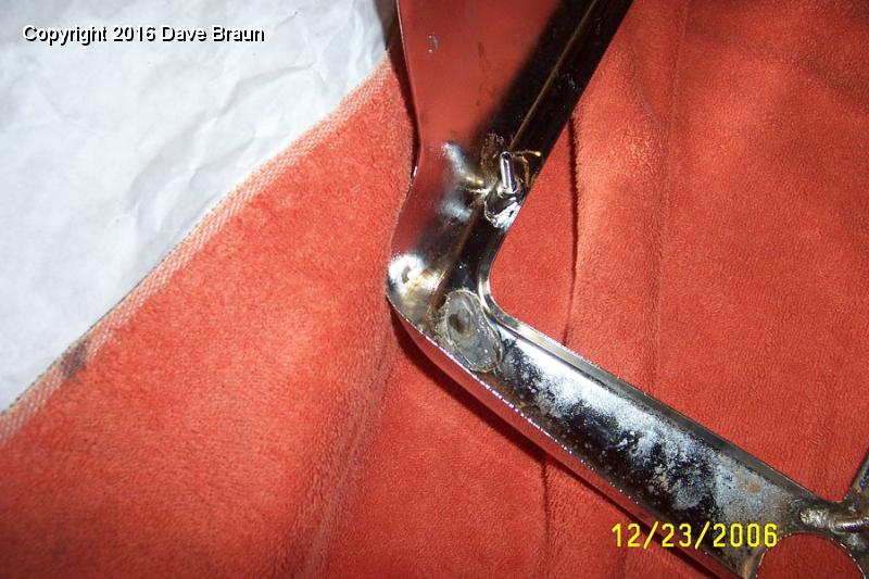 JB Weld grille surround stud.jpg - Installing a stud that fell off during plating. Gary Krukoski supplied this stud. I ground off the edges until it fit the old solder impressions, added some JB Weld and we'll see how we make out! Heat from a braxing torch may have discolored the chrome.