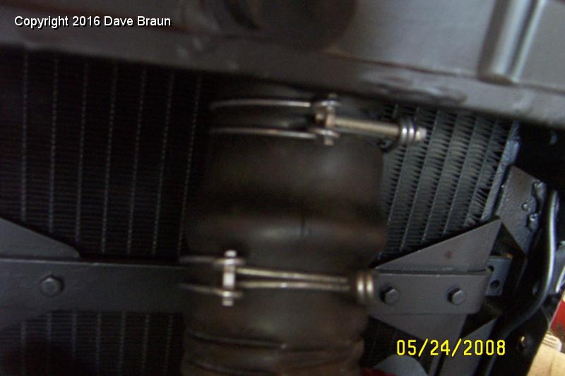 Removing old upper hose 2.jpg - Another view of the upper radiator hose from the engine side. You can see one of the vertical cracks in this view, right in the center.