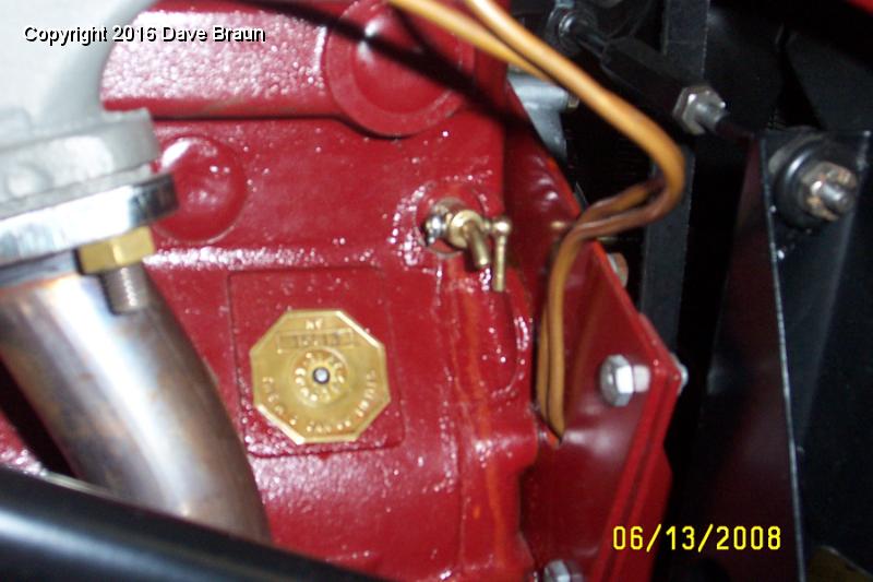 Repaired drain tap does not leak.jpg - The system is full, and the original block tap is installed. And guess what? It doesn't leak. The original is a little harder to operate with the handle so close to the engine bearer plate. The replacement unit had the handle at the top, which seemed to function better. MG must have taken what they could get back in the day, and the design was 'improved' when it was reproduced.