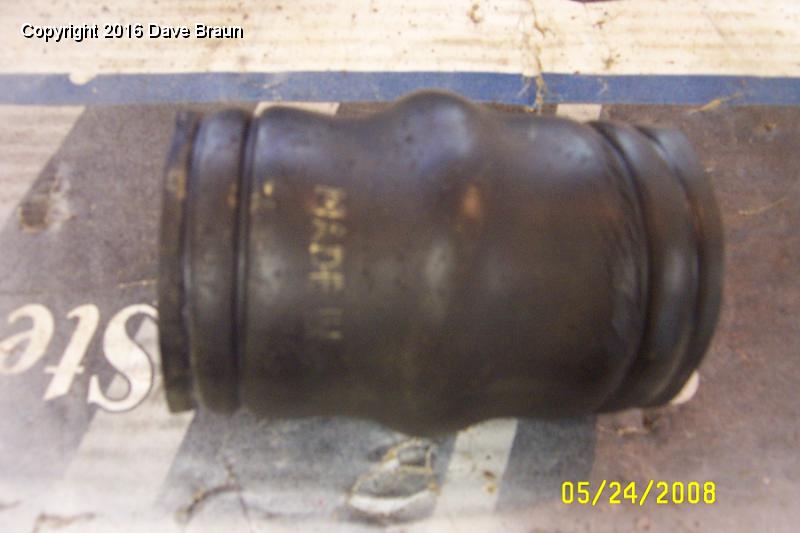 Splits show in old hose.jpg - More cracks visible around the upper radiator clamp location.