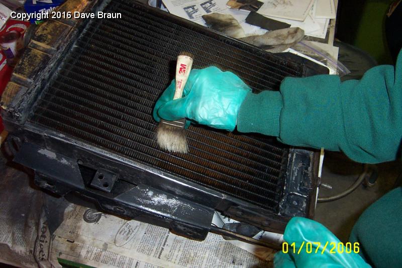 acetone cleaning of radiator after sanding.JPG - Acetone to tack up the sanded grit. I really considered re-coring, but I don't think it will be that big of a deal to pull the radiator if I have problems down the road. I'll have a good baseline on my engine cooling by then, and if I have to re-core, I'll know if it improved things.