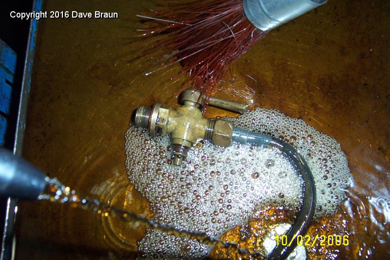 cleaning ebay rad tap 2.JPG - Found on ebay. This original radiator tap and tube is much better than the Moss version. The unit from Moss is not threaded to accept the drain tube, making draining the radiator a mess. My original had a broken handle. I'll disassemble this one, clean it and lube it.