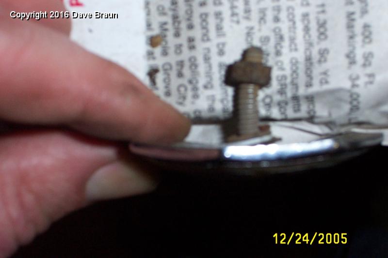 emblem stud bent.JPG - Emblem has a bent stud. I was pretty worried about fixing this, but patience and careful work straightened it without tearing it off or otherwise damaging it.