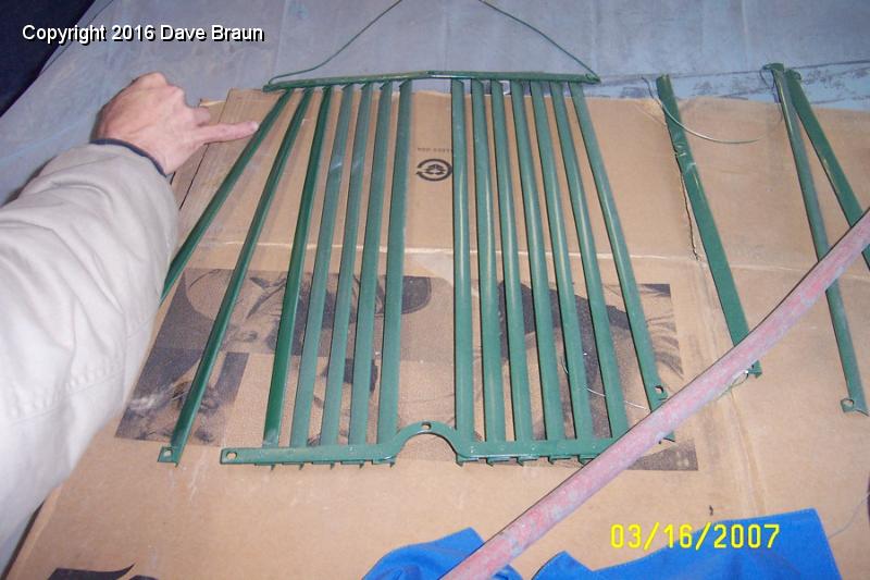 grille slats paint  some flaws some dust.jpg - Radiator grille slats with a coat of grean and dust. The grille has some minor flaws. The paint lifted the second time the body guy coated it. Brian is still working on it.