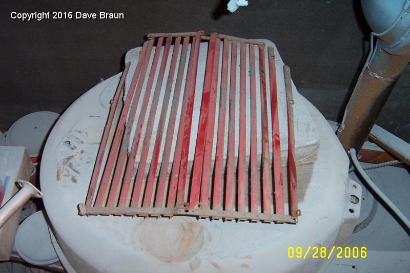 replacement grille ready for stripping.JPG - Traded grilles. The chrome grille was wanted by another owner who has a black interior (as I had before I started the restoration). I felt that stripping the chrome would be a crime if someone wanted one, and it would clean up very nicely as a driver. I fetched it back from the chrome stripper and I traded, as what I needed was a grille I could paint to match the interior.