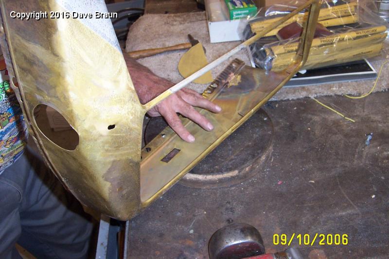 working out dents.JPG - Checking the back side. Notice the fill material.