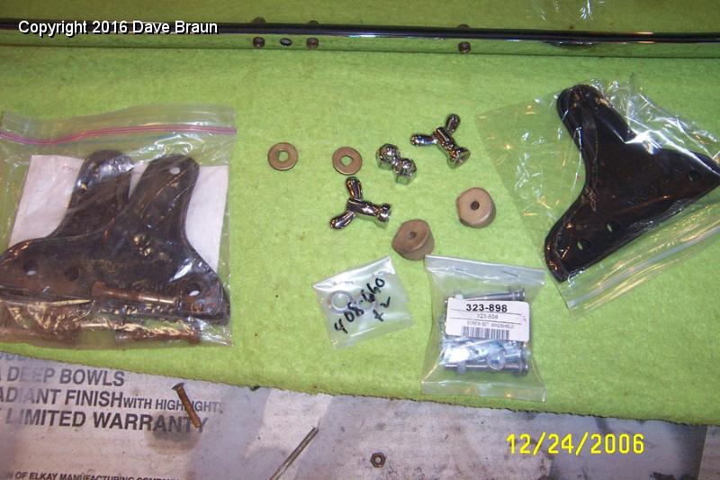 Windscreen mounting hardware old and new.jpg - Old and new mounting hardware. Some of this stuff came with the car, the wedge spacers are original and cleaned up as are the washers with the D hole. The gaskets and mounting screws are new. The wingnuts are extra which came with the car (in 1987!)