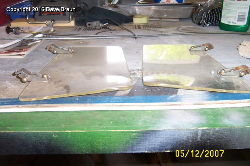 Windwings before0002.jpg - Wind wings for blocking wind. They have a slight curve where they lay upon the side of the cowl. Even though they are the same make and model, the attaching hardware has much better chrome on one of them. I'll polish the acrylic with a compound.