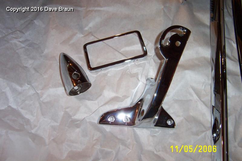 chromed pcs back first batch.JPG - First pieces back from chrome. A side lamp housing, the mirror frame, a windshield stanchion and the windscreen frame.