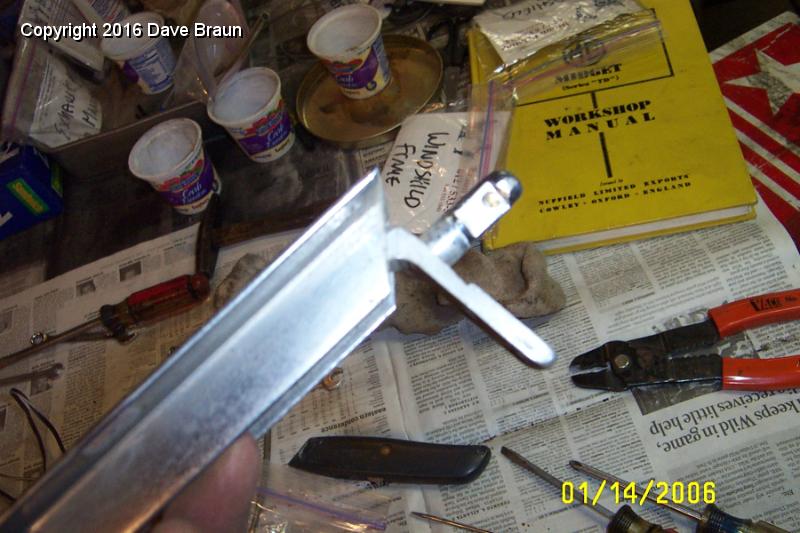 convertible top post on upper angle bracket.JPG - Windscreen top post. The upper angle bracket fastens the windscreen frame together and it acts as a place to secure the convertible hood.