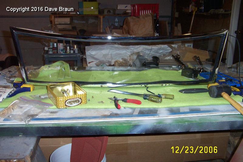 gasket ready for trimming.jpg - The glass and bottom frame installed. The center of the bottom frame had to be pushed down onto the glass. The gasket material still needs to be trimmed, but I got interupted adjusting the miter on one of the gasket corners.