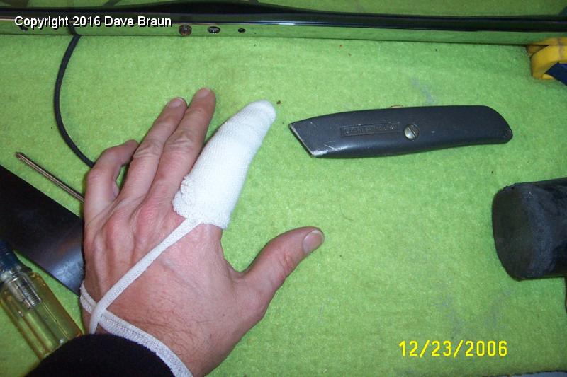 some blood was shed.jpg - Some blood was shed mitering the gasket corners. One corner was a bit off. I trimmed out some more material, and got my left hand too close. Because of the coumadin, I bleed too much for good healing, and although I didn't quite go through the subcanteous layer, I needed a cleaning, a skin bond, and for good measure, a tetenous booster.